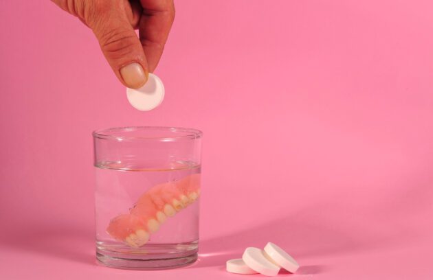 dentures soaking in a denture cleaning solution